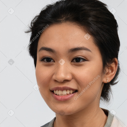 Joyful latino young-adult female with medium  brown hair and brown eyes