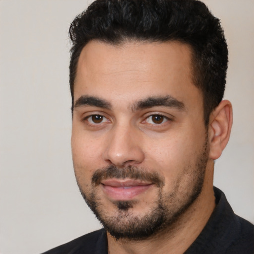 Neutral latino young-adult male with short  black hair and brown eyes