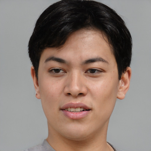 Joyful asian young-adult female with short  brown hair and brown eyes