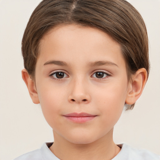 Joyful white child female with short  brown hair and brown eyes