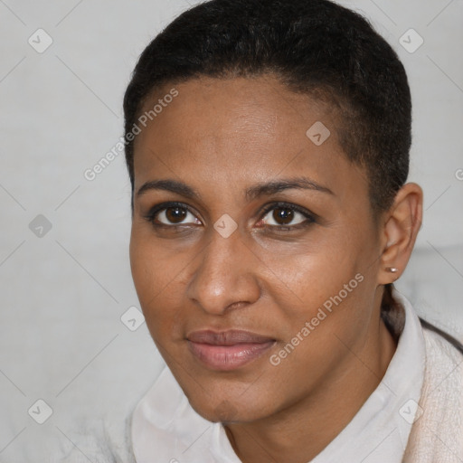 Joyful black young-adult female with short  brown hair and brown eyes