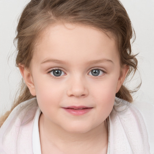 Joyful white child female with medium  brown hair and blue eyes