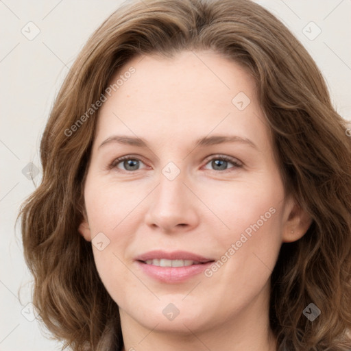 Joyful white young-adult female with long  brown hair and green eyes