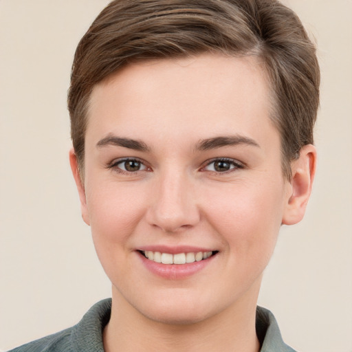 Joyful white young-adult female with short  brown hair and grey eyes