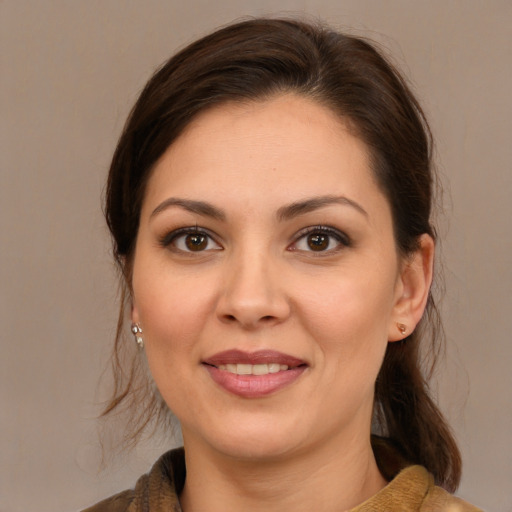 Joyful white young-adult female with medium  brown hair and brown eyes