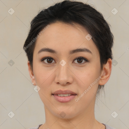 Joyful asian young-adult female with short  brown hair and brown eyes