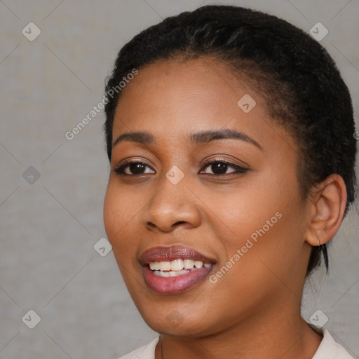 Joyful black young-adult female with short  black hair and brown eyes