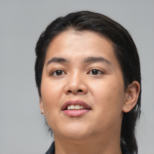 Joyful asian young-adult female with medium  black hair and brown eyes