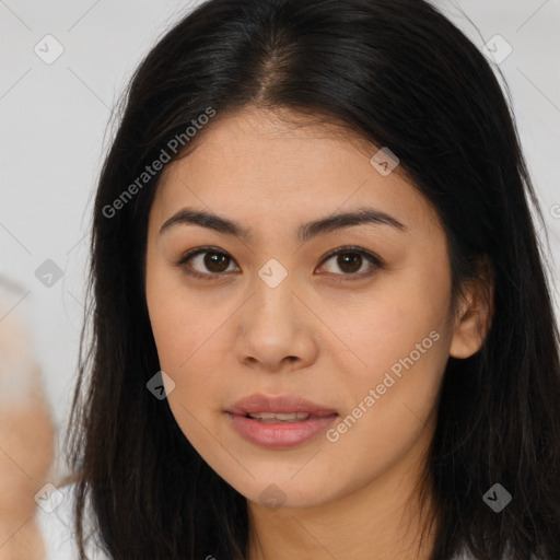 Joyful asian young-adult female with long  brown hair and brown eyes