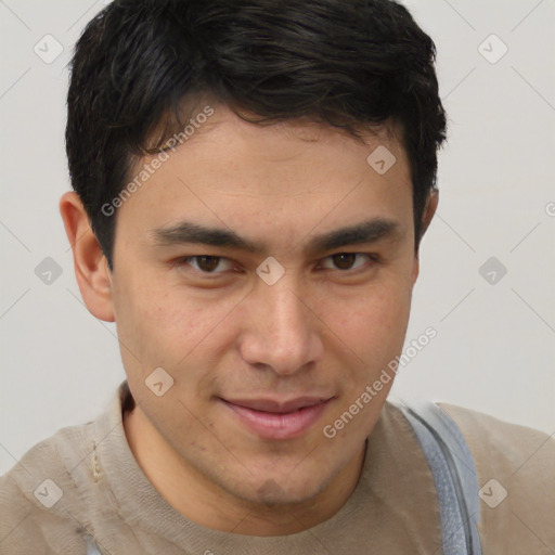 Joyful latino young-adult male with short  brown hair and brown eyes