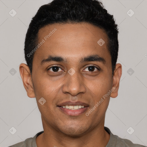 Joyful latino young-adult male with short  black hair and brown eyes