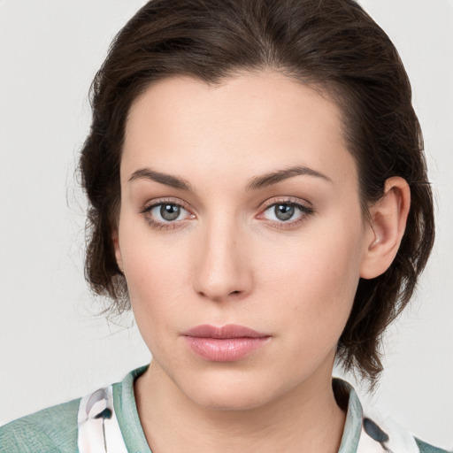 Neutral white young-adult female with medium  brown hair and grey eyes