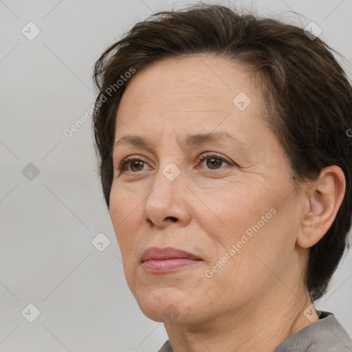 Joyful white adult female with short  brown hair and brown eyes