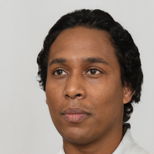 Neutral black young-adult male with short  black hair and brown eyes