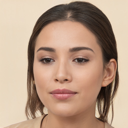 Joyful white young-adult female with medium  brown hair and brown eyes