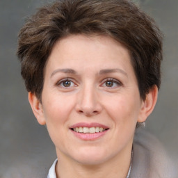 Joyful white adult female with short  brown hair and brown eyes