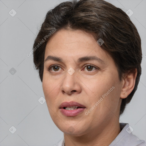 Joyful white adult female with short  brown hair and brown eyes