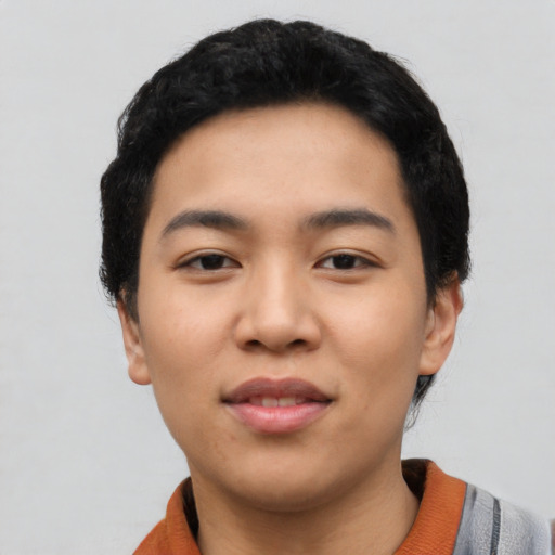 Joyful asian young-adult female with short  black hair and brown eyes