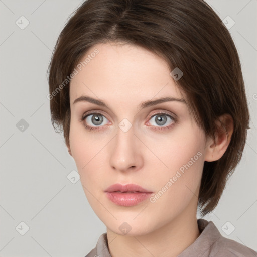 Neutral white young-adult female with medium  brown hair and grey eyes