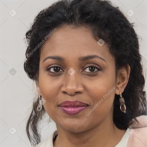 Joyful black adult female with medium  brown hair and brown eyes