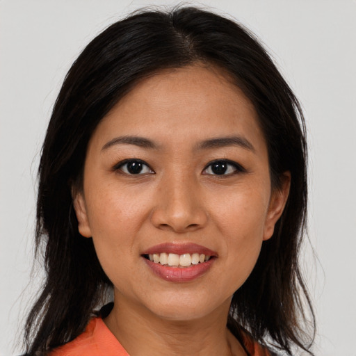 Joyful asian young-adult female with medium  brown hair and brown eyes