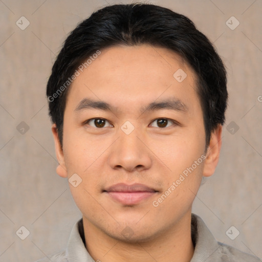 Joyful asian young-adult male with short  brown hair and brown eyes