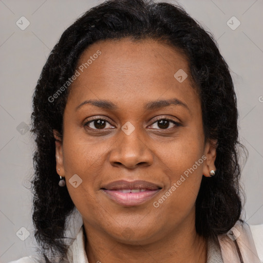 Joyful black young-adult female with medium  brown hair and brown eyes