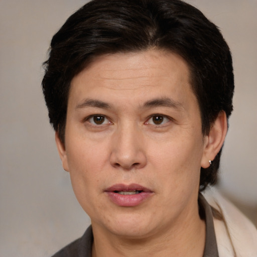 Joyful white adult male with medium  brown hair and brown eyes
