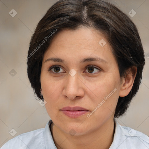 Joyful white adult female with medium  brown hair and brown eyes