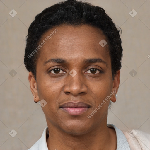 Joyful black young-adult female with short  black hair and brown eyes