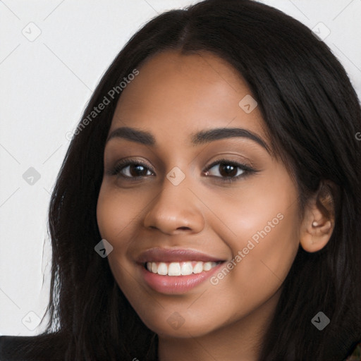 Joyful latino young-adult female with long  black hair and brown eyes