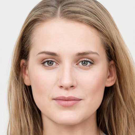 Joyful white young-adult female with long  brown hair and blue eyes