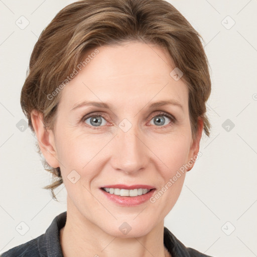 Joyful white adult female with medium  brown hair and grey eyes