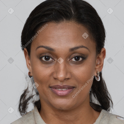 Joyful black young-adult female with medium  brown hair and brown eyes