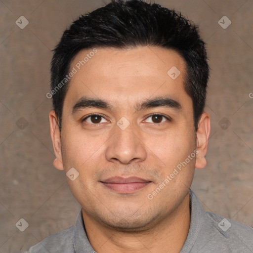 Joyful white young-adult male with short  black hair and brown eyes