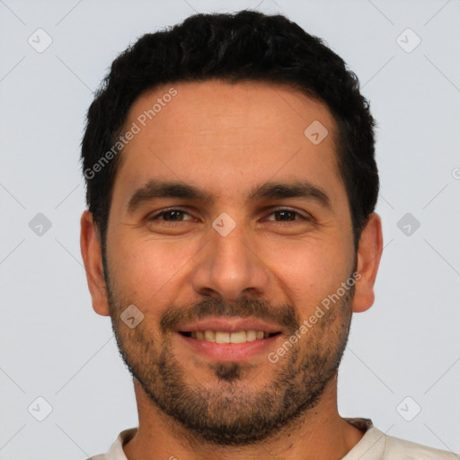 Joyful white young-adult male with short  black hair and brown eyes