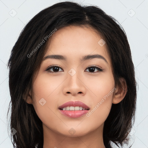 Joyful asian young-adult female with long  brown hair and brown eyes