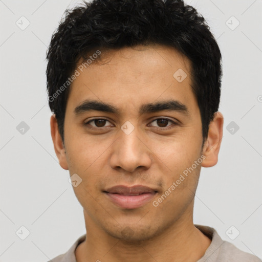 Joyful latino young-adult male with short  black hair and brown eyes