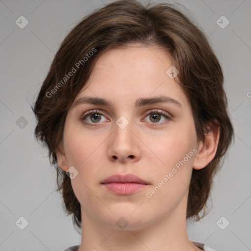 Neutral white young-adult female with medium  brown hair and brown eyes