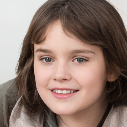 Joyful white child female with medium  brown hair and grey eyes