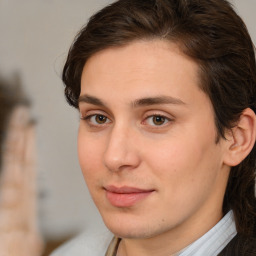 Joyful white young-adult male with medium  brown hair and brown eyes