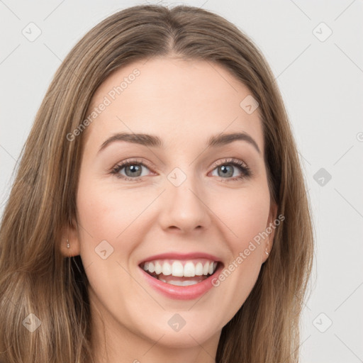 Joyful white young-adult female with long  brown hair and green eyes