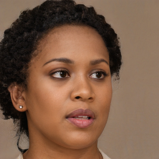 Neutral black young-adult female with long  brown hair and brown eyes