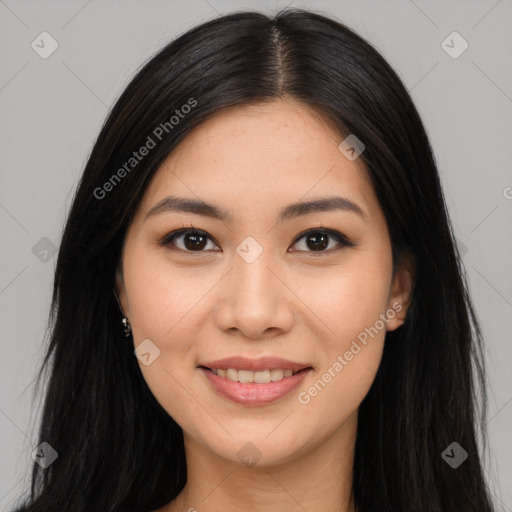 Joyful asian young-adult female with long  brown hair and brown eyes