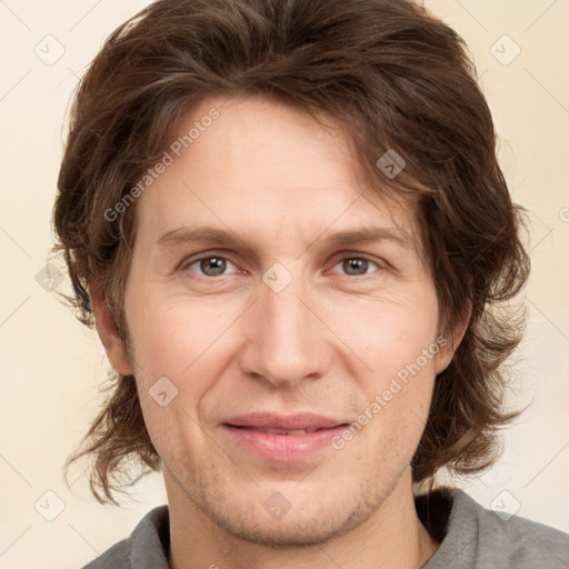 Joyful white adult male with short  brown hair and grey eyes