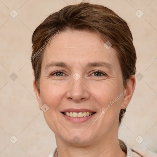 Joyful white adult female with short  brown hair and brown eyes