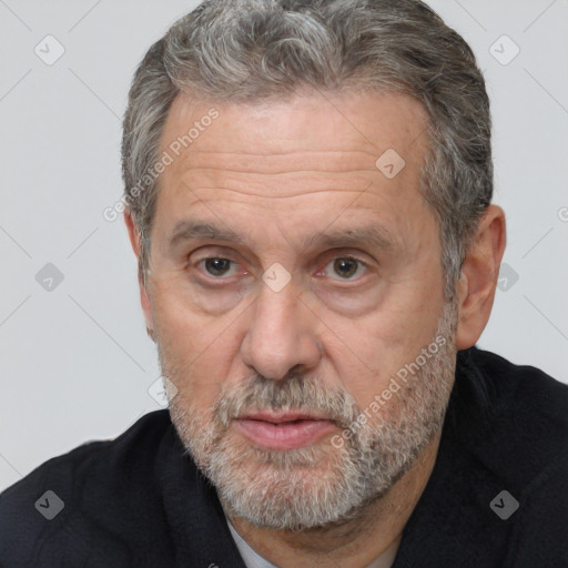 Neutral white middle-aged male with short  gray hair and brown eyes