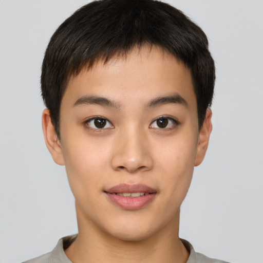 Joyful asian young-adult male with short  brown hair and brown eyes