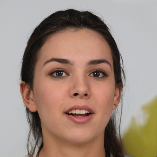 Joyful white young-adult female with medium  brown hair and brown eyes