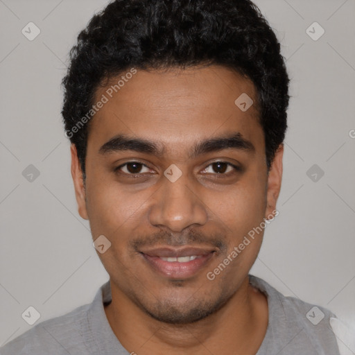 Joyful black young-adult male with short  black hair and brown eyes